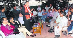 Transport, Food and Civil Supplies and Technical Education Minister GS Bali addresses private bus operators in Shimla on Tuesday.