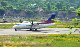 An aircraft lands at the Kullu airport.