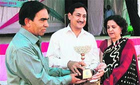 Principal of MLSM College presents a memento to CPS Sohan Lal in Sundernagar on Tuesday.