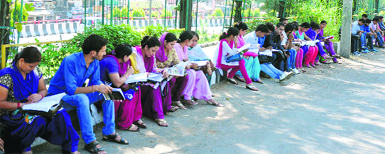 Students outside an examination centre in Jammu on Tuesday. Tribune photo: Anand Sharma