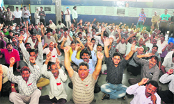 Members of the Northern Railway Mens Union protest in support of their demands at the railway station in Jammu on Tuesday. Tribune photo: Anand Sharma