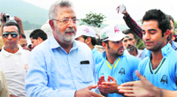 The Minister for Medical Education, Youth Services and Sports, Taj Mohiuddin, interacts with students after their return from Watan Ki Sair. A Tribune photograph