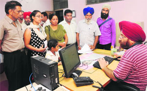 Applicants at the passport office in Sector 34, Chandigarh. 