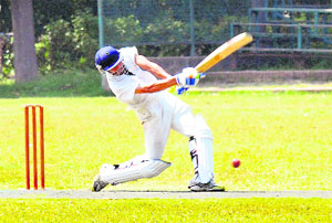 A batsman hits the ball during a cricket match at Panjab University in Chandigarh on Wednesday. 