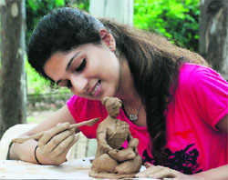 A student designs a clay model during a workshop at MCM DAV College in Sector 36, Chandigarh, on Wednesday.