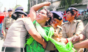 A UKD (Airy) worker being taken away by the police for holding a protest near the Assembly complex in Dehradun on Wednesday. 