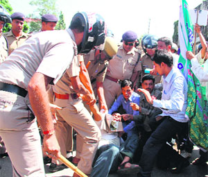 Workers of UKD (Aeri) being detained by the police while proceeding towards the Assembly in support of their demands in Dehradun on Wednesday. 