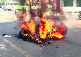 A police motorcycle set on fire by protesting students on the Ambala-Jagadhri highway in Ambala on Wednesday
