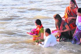 Devotees immerse an idol of Lord Ganesha in the Yamuna canal in Karnal on Wednesday