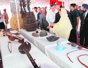 Chief Minister Omar Abdullah looks at artefacts after the inauguration of the two-day heritage exhibition in Srinagar.