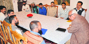 Governor NN Vohra meets a delegation of the J&K Handicapped Association in Srinagar on Wednesday.