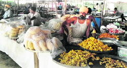 Sweetmeat vendors wait for customers at Chhapar Mela on Wednesday. A Tribune photograph 