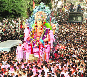 Devotees take a Ganesh idol for immersion in Mumbai on Wednesday. 