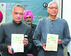 Punjab Governor Shivraj Patil releases Punjab: A History From Aurangzeb to Mountbatten, written by Rajmohan Gandhi (right), grandson of Mahatma Gandhi, at a function in Chandigarh on Wednesday. 