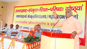 Parmarth Niketan representative Ram Mahesh Mishra speaking at the annual meeting of principals of Sanskrit-based schools and colleges in Rishikesh on Thursday. 