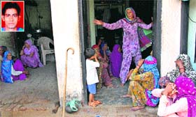 Women mourn Dharmender's (inset) death in Garnawathi village.