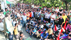 Activists of CITU stage a protest rally at the Deputy Commissioner's office in Shimla on Thursday