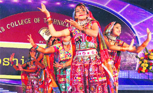 Students present a cultural item during Koshish, a mega event, in Ludhiana on Thursday. 