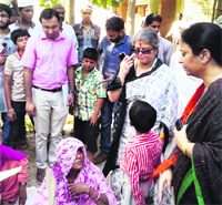 National Women Commission chairperson Mamta Sharma visits riot-affected Shahpur village in Muzaffarnagar district on Thursday.  PTI