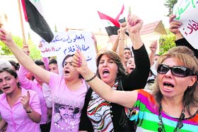 Supporters of President Basher al-Assad at a rally in Damascus on Thursday