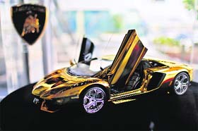 Glitter & Gloss: A gold Lamborghini model on display in Dubai on Thursday