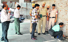 The MC's house tax team seals a travelling agency in Ranjit Avenue, Amritsar, after its proprietor failed to clear dues. 