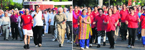 Elderly participate in “Walk For Fun” organised by the Senior Citizens’ Association in collaboration with the Chandigarh Police at Sukhna Lake on Friday.