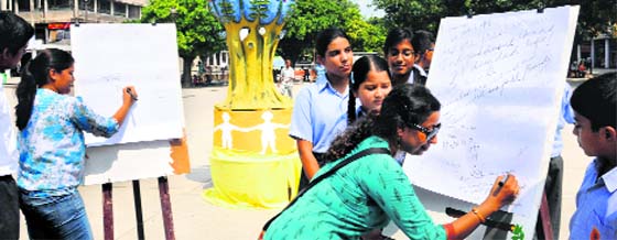 Students of a private school organise a signature campaign on the eve of International Day of Peace in Chandigarh on Friday.