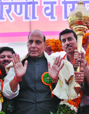  BJP president Rajnath Singh with Olympic medal winner and party member Rajyavardhan Singh Rathore during the party's Sports Cell's National Executive. meeting in New Delhi on Friday. 