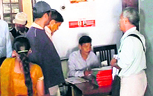 Residents fill forms for new ration cards under the Food Security Bill scheme in Mussoorie on Friday
