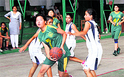A match in progress in the 9th Gardener Silver Jubilee Inter-School Basketball Tournament, played at St Thomas College in Dehradun on Friday