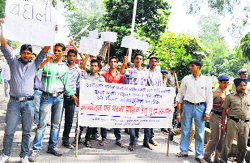 Sacked policemen stage a protest near the Assembly in Dehradun on Friday. They are demanding 