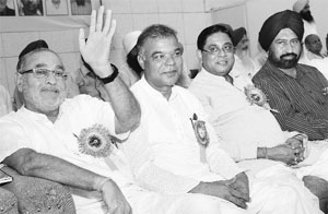 Prahlad Modi (extreme left) at a conference of the All-India Depot Holders Association in Chandigarh on Friday.