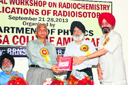 BARC Radio-Chemistry Isotope Group Director Dr KL Ramakumar (left) being honoured in Amritsar on Saturday.  