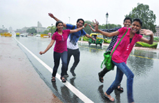 The foursome enjoying the rain at Rajpath in New Delhi on Saturday. T