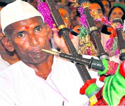 A man plays the traditional bagpipe during a religious programme in Haridwar on Saturday.