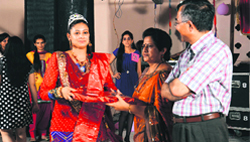 Amita Kalia receives the title of Miss Fresher from Dr Rekha Kalia Bhardwaj, chief guest, at a function held at the girls hostel of DAV University in Jalandhar on Saturday. A Tribune photograph 