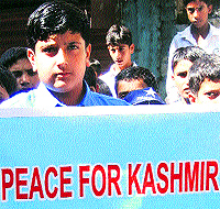 A boy takes part in the World Peace Day celebrations in PoK