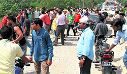 Residents stage a protest against poor road conditions and block NH-1C at Sula Park in Reasi on Saturday. The blockade lasted for three hours