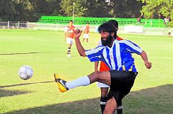 Players in action during the State Power Development Corporation Annual League Football Tournament in Srinagar on Saturday