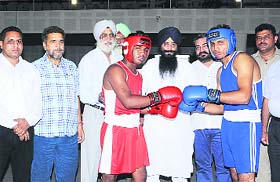Sharanjit Singh Dhillon, PWD Minister, with participants of the 46th State Junior Boxing Championship in Doraha on Saturday.
