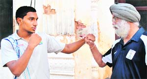The boxer with national boxing coach Gurbax Singh Sandhu