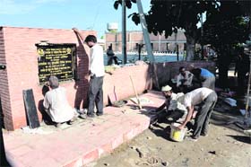 Workers giving final touches to the stone meant for inauguration of the park by Deputy Chief Minister Sukhbir Singh Badal