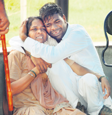 The victims husband and his mother mourn her death at the Civil Hospital in Ambala City
