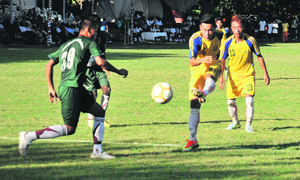 Players in action during a match of the Administrator Football Cup at the football stadium, Sector 17, Chandigarh, on Sunday.