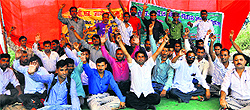 Unemployed physical education teachers stage a dharna in support of their demands at Hindi Bhawan in Dehradun on Sunday