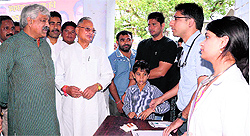 Assembly Speaker Govind Singh Kunjwal and Planning Minister Dinesh Aggarwal at a free health check-up camp in Dehradun on Sunday
