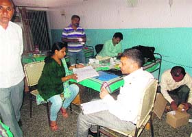 Officials of the FDA and the Health Department prepare a report after a raid on Radha Kamboj's clinic at Fatehabad on Sunday