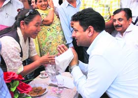 Minister for Housing and Urban Development Sudhir Sharma listens to public grievances at Gamru village near Dharamsala on Sunday