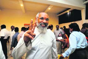 CV Wigneswaran, Chief Minister candidate from the TNA, flashes a victory sign in Jaffna on Sunday